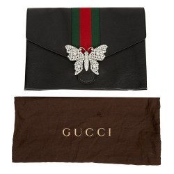 Gucci grained leather pouch and butterfly brooch