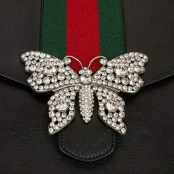 Gucci grained leather pouch and butterfly brooch