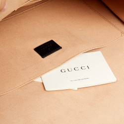 Gucci grained leather pouch and butterfly brooch