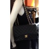 CHANEL jumbo black lambskin and golden chain bag