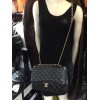 CHANEL jumbo black lambskin and golden chain bag