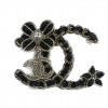 Broche CHANEL dorée entrelacéesz cuir