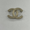 Broche CHANEL striée dorée