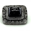 Broche CHANEL cabochon noir