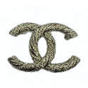 CHANEL twisted gilded CC brooch