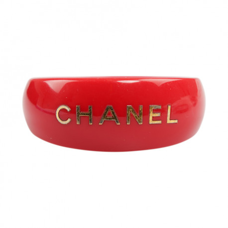 CHANEL red resin and gold inscription bracelet