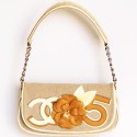 CHANEL bag in beige canvas and varnished camelia