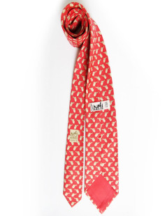 Cravate HERMES rouge en soie motifs selles