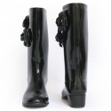 Black rain CHANEL T37 boots with camellias