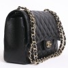 Sac Jumbo CHANEL en cuir caviar noir doré