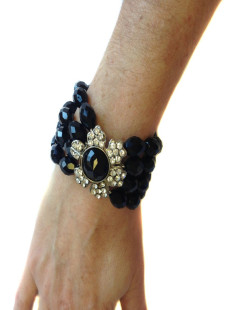 Bracelet à perles noires facettées et fleur en strass