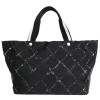 Sac cabas CHANEL noir et blanc "ligne voyage"