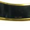 Large HERMES bracelet in black enamel and gilt gold metal