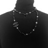 Long sautoir CHANEL en perles velours , acier et noires