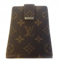 Wearing LOUIS VUITTON checkbook in monogrammed and leather coated canvas