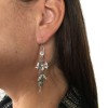 Boucles d'oreille clous DIOR en métal argenté et strass