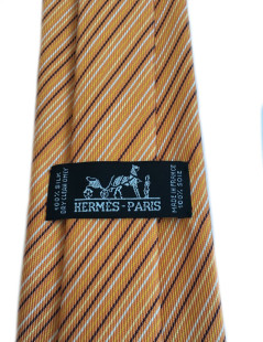 Cravate HERMES en twill de soie orange à rayures