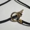 Collier HERMES lien noir et bijouterie or