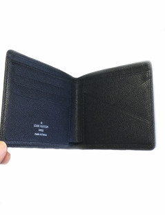 Multiple LOUIS VUITTON taiga leather wallet