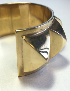 HERMES Collier De Chien rigid cuff bracelet in gilded metal