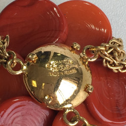 CHANEL couture necklace in gilded metal and camellia pendant in orange molten glass