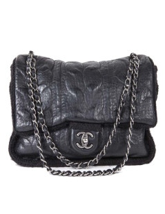 CHANEL flap bag in black wool and aged leather