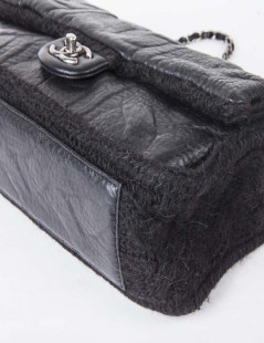 CHANEL flap bag in black wool and aged leather