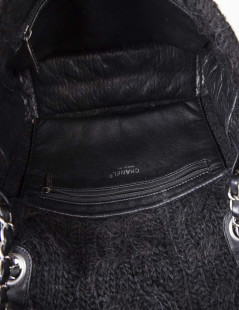 CHANEL flap bag in black wool and aged leather