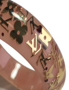 Bracelet LOUIS VUITTON rose transparent à inclusions "LV" 