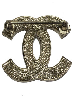 Broche CC CHANEL en métal doré