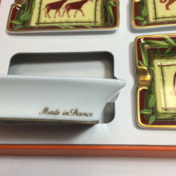 HERMES set of 4 mini ashtrays in white porcelain with animal pattern