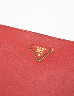 PRADA clutch in black and red grained leather