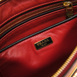 PRADA clutch in black and red grained leather