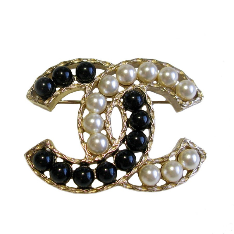 Broche CHANEL CC en métal doré et perles nacrées et noires