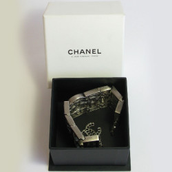 CHANEL Couture articulated cuff bracelet in matte silver metal set with Swarovski rhinestones