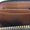  LOUIS VUITTON "Zippy" wallet in brown monogram canvas