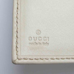 Portefeuille GUCCI cuir embossé GG beige