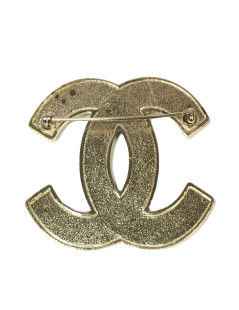 Broche CHANEL CC en métal doré