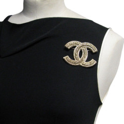 Broche CHANEL CC en métal doré