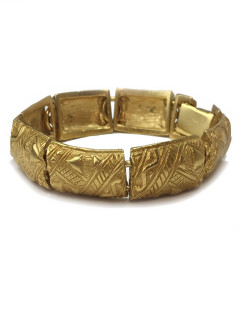 YVES SAINT LAURENT rigid bracelet in gilt metal