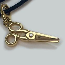 DIOR necklace with a scissors charm in gold and small diamond