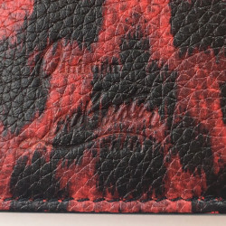 Portefeuille CHRISTIAN LOUBOUTIN en cuir rouge motif léopard