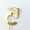 CHANEL number 5 pin in gilt metal