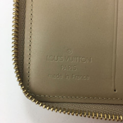 Porte-monnaie LOUIS VUITTON en cuir monogram beige verni