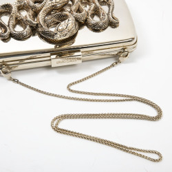 ROBERTO CAVALLI Minaudière in mirror effect gilt metal and snake ornament