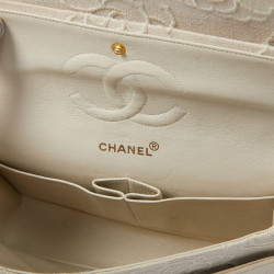 A NETTOYERSac motifs camélias CHANEL toile beige