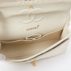 A NETTOYERSac motifs camélias CHANEL toile beige