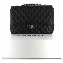 CHANEL jumbo black lambskin and golden chain bag