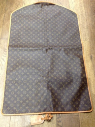 Cover carries LOUIS VUITTON Monogram Canvas clothes